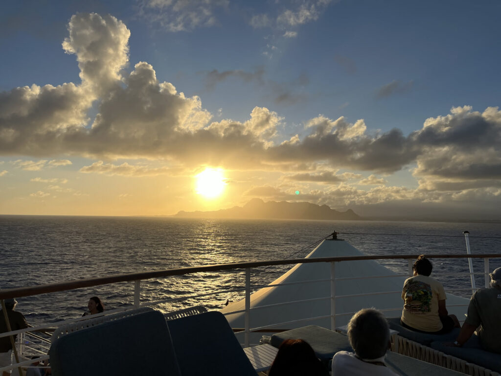 Sunset view from the front of a cruise ship.