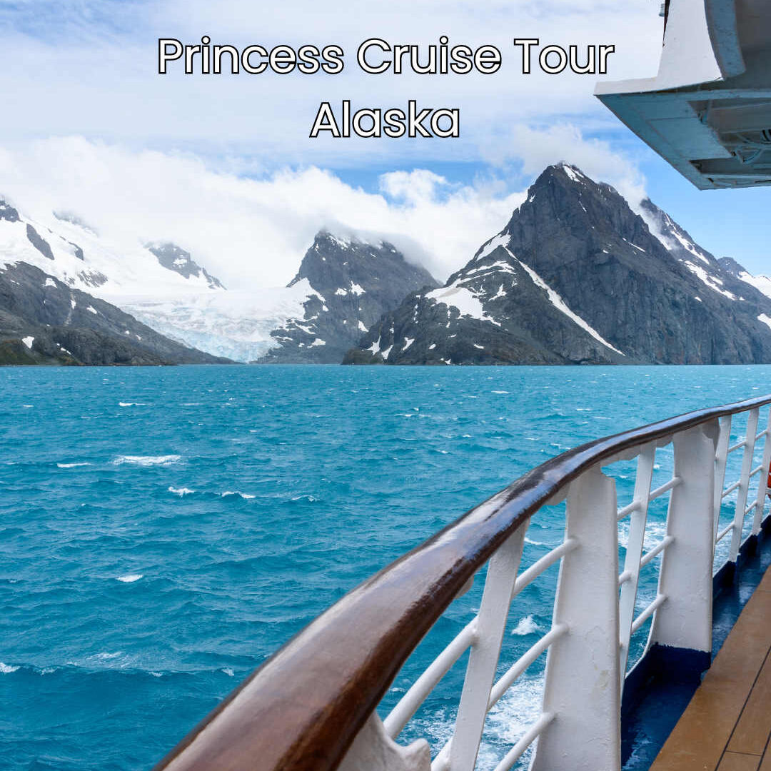 Photo taken from a ship showing turquoise water and glacial mountains in the background.